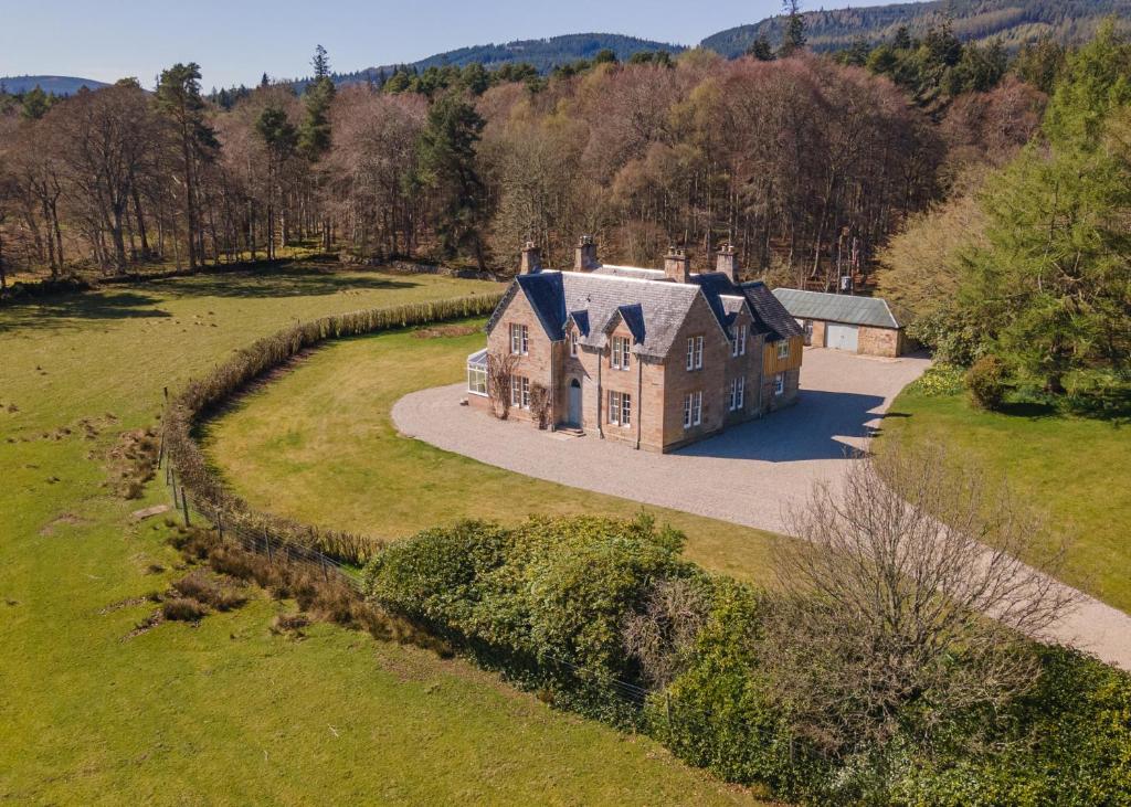 an aerial view of a large house in a field at Dalgheal in Evanton