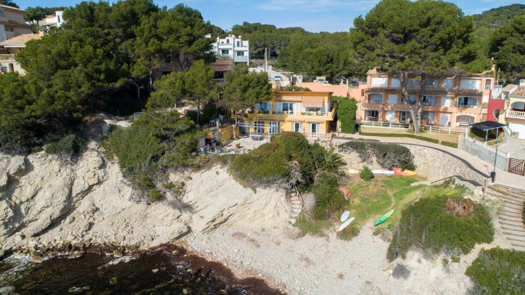 an aerial view of a house on a cliff at PuntBlanc Residences in Sant Elm