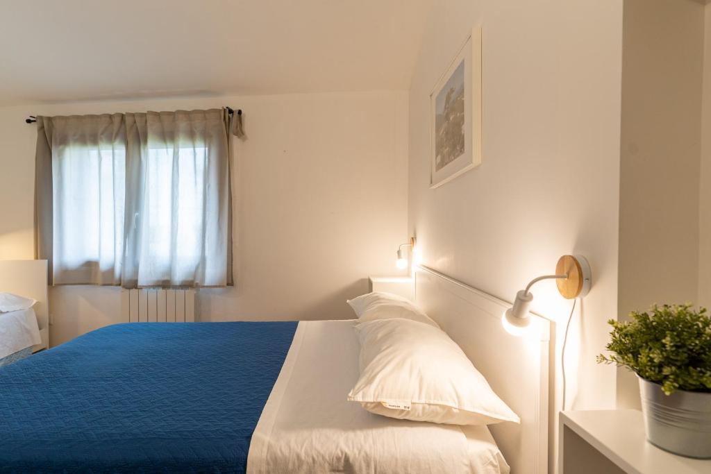 Postel nebo postele na pokoji v ubytování Casa dell'Escursionista