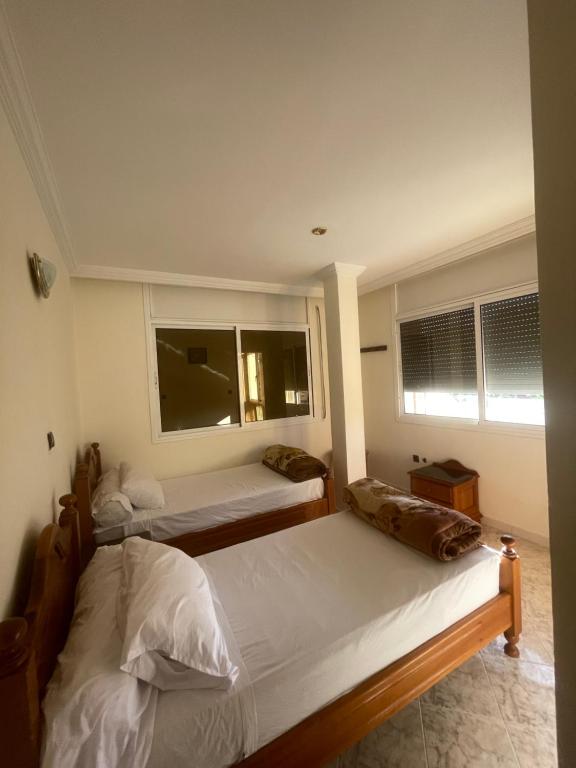 Postel nebo postele na pokoji v ubytování Hôtel ALMUNECAR