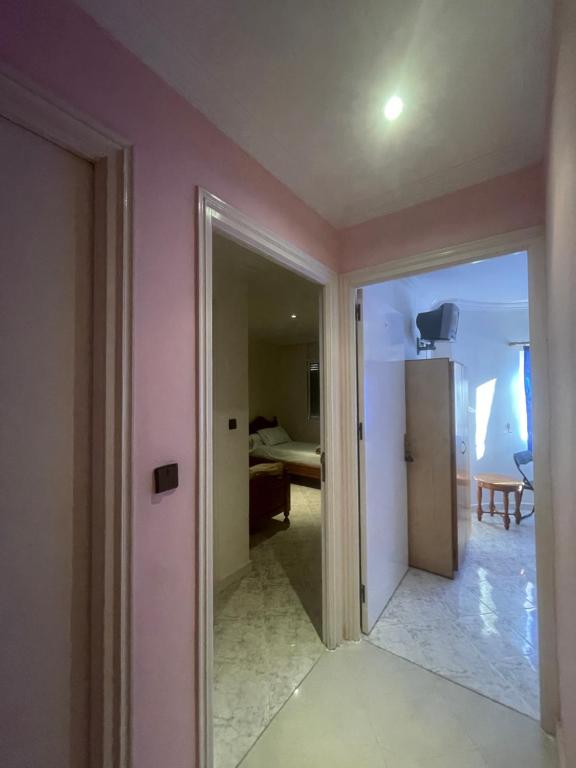 Postel nebo postele na pokoji v ubytování Hôtel ALMUNECAR
