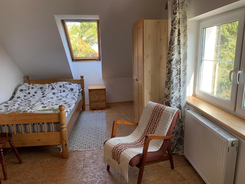 Posteľ alebo postele v izbe v ubytovaní Apartament na poddaszu