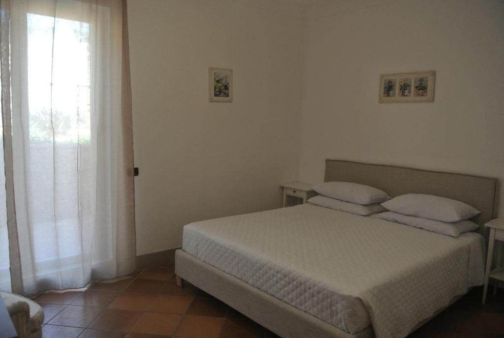 Postel nebo postele na pokoji v ubytování Villa Carlotta Resort