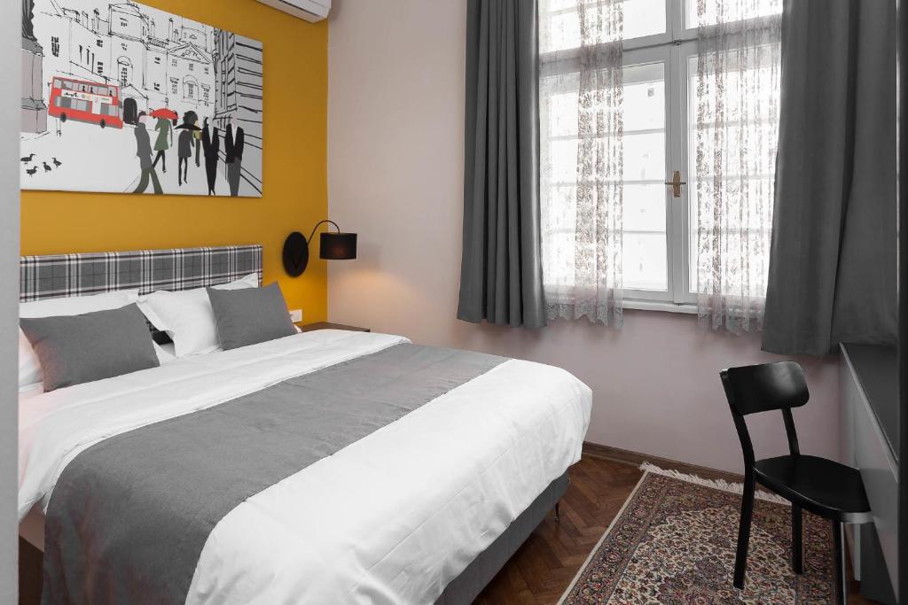 Postel nebo postele na pokoji v ubytování Hotel London B&B