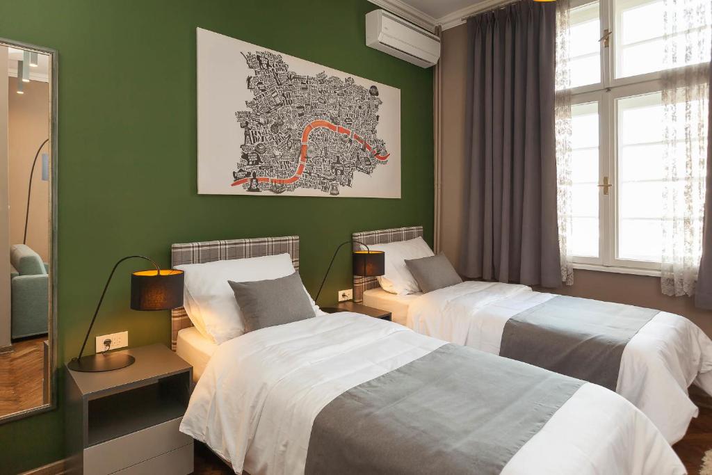 Postel nebo postele na pokoji v ubytování Hotel London B&B
