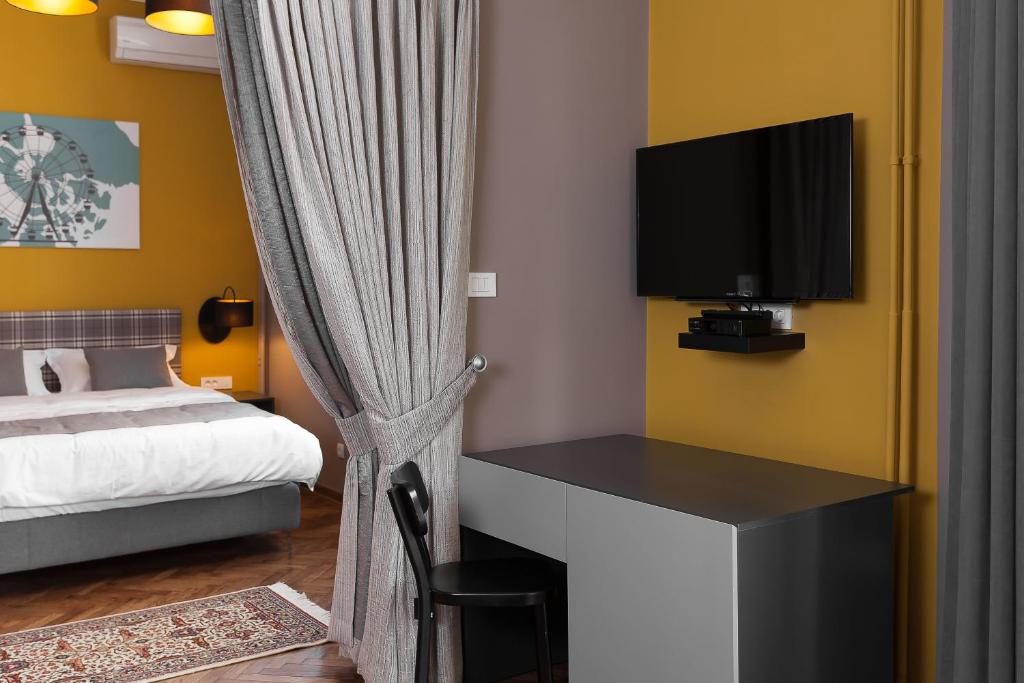 Postel nebo postele na pokoji v ubytování Hotel London B&B