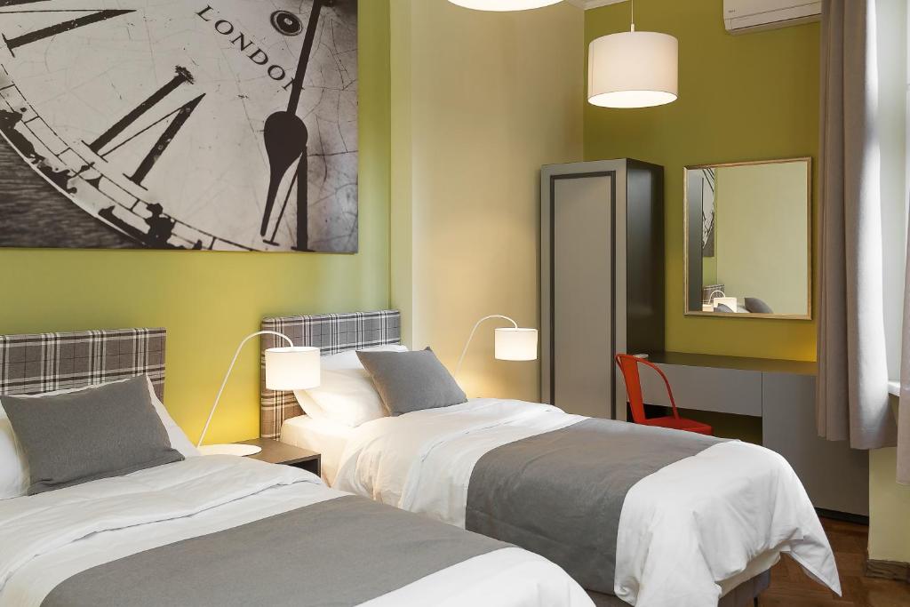 Postel nebo postele na pokoji v ubytování Hotel London B&B