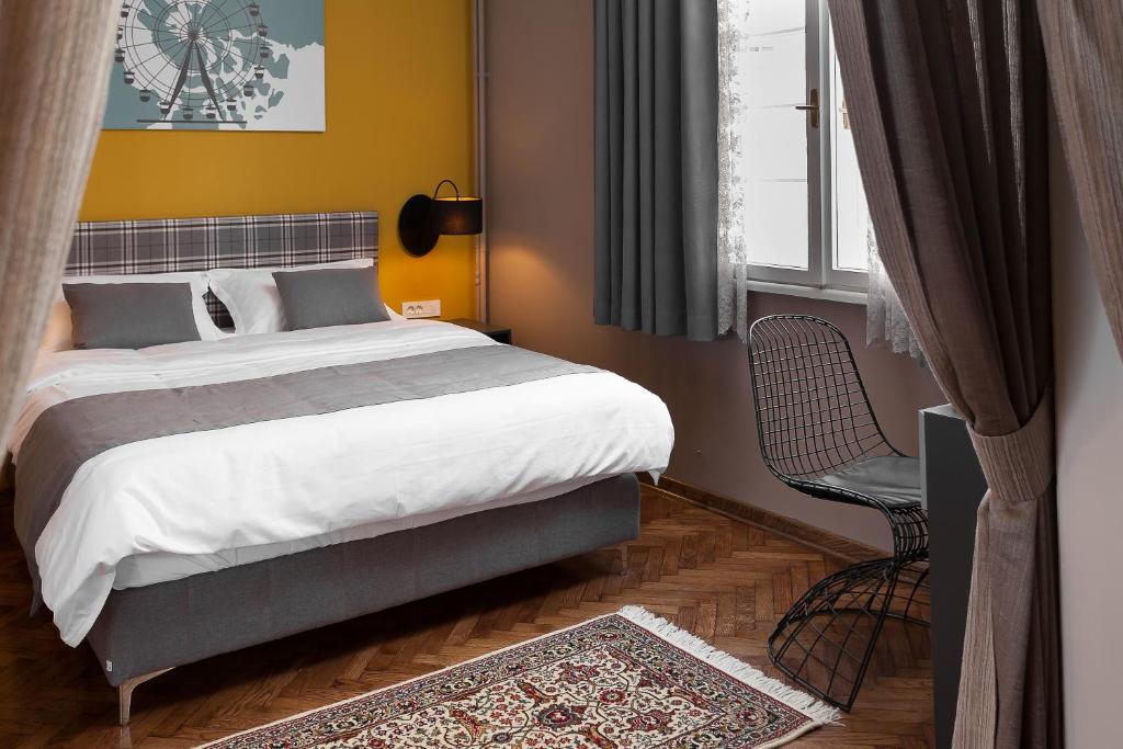 Postel nebo postele na pokoji v ubytování Hotel London B&B