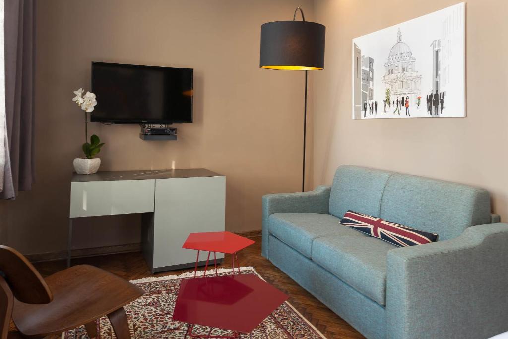 TV a/nebo společenská místnost v ubytování Hotel London B&B