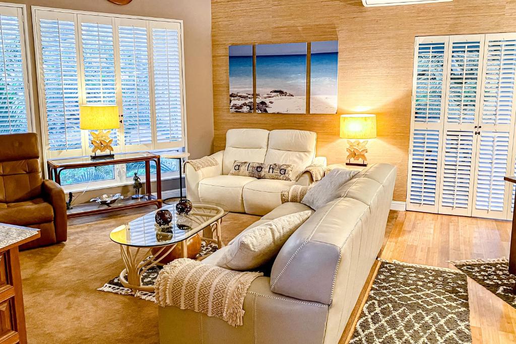 a living room with a couch and a table at Keauhou Paradise at Mauna Loa Village #10 in Kailua-Kona