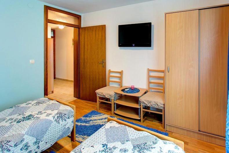 Postel nebo postele na pokoji v ubytování Apartments Stari most