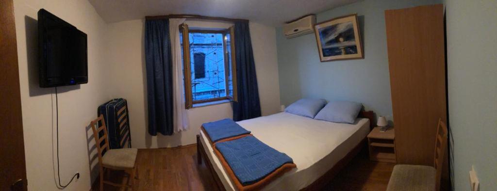 Postel nebo postele na pokoji v ubytování Apartments Stari most