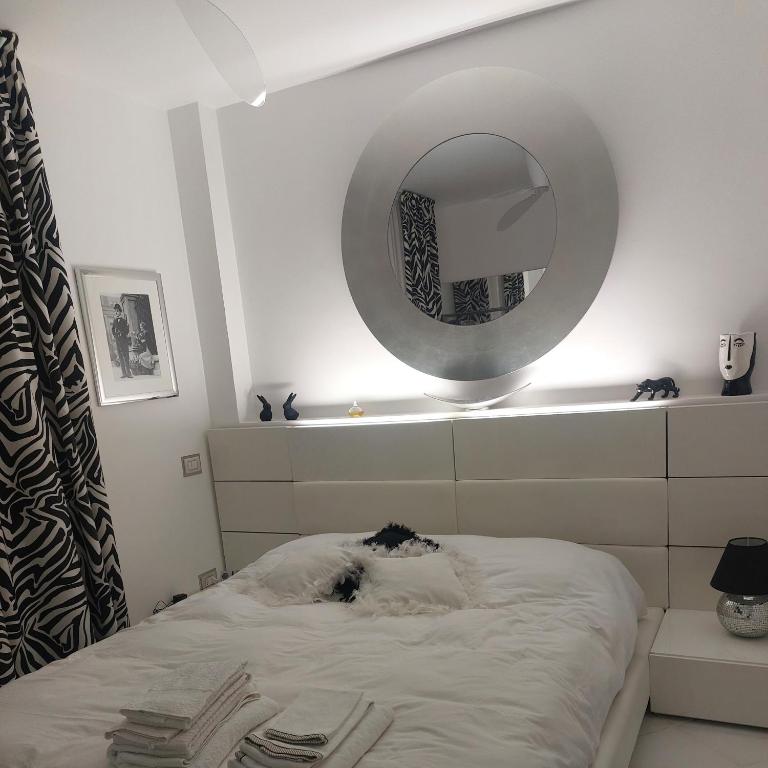 Posteľ alebo postele v izbe v ubytovaní Condominio Imperiale