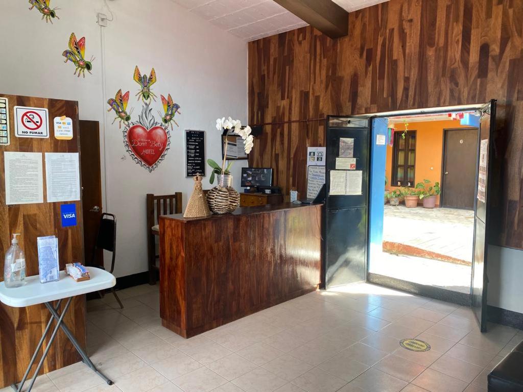 a lobby with a cash register and a door in a room at El Rincón de Doña Bety in Oaxaca City