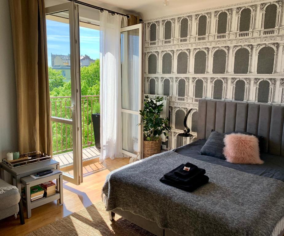 Posteľ alebo postele v izbe v ubytovaní Słoneczny Apartament Koszykowy!