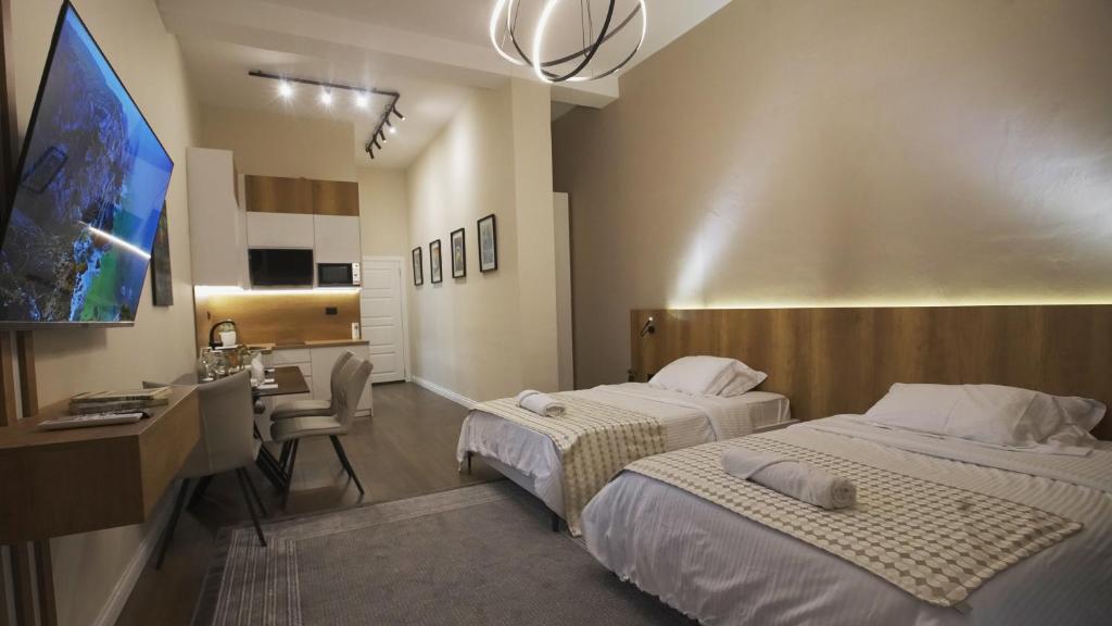 Кровать или кровати в номере Daily Rent Studio Apartments