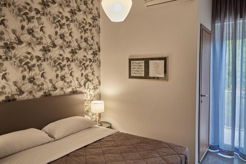 Postel nebo postele na pokoji v ubytování Hotel Spring