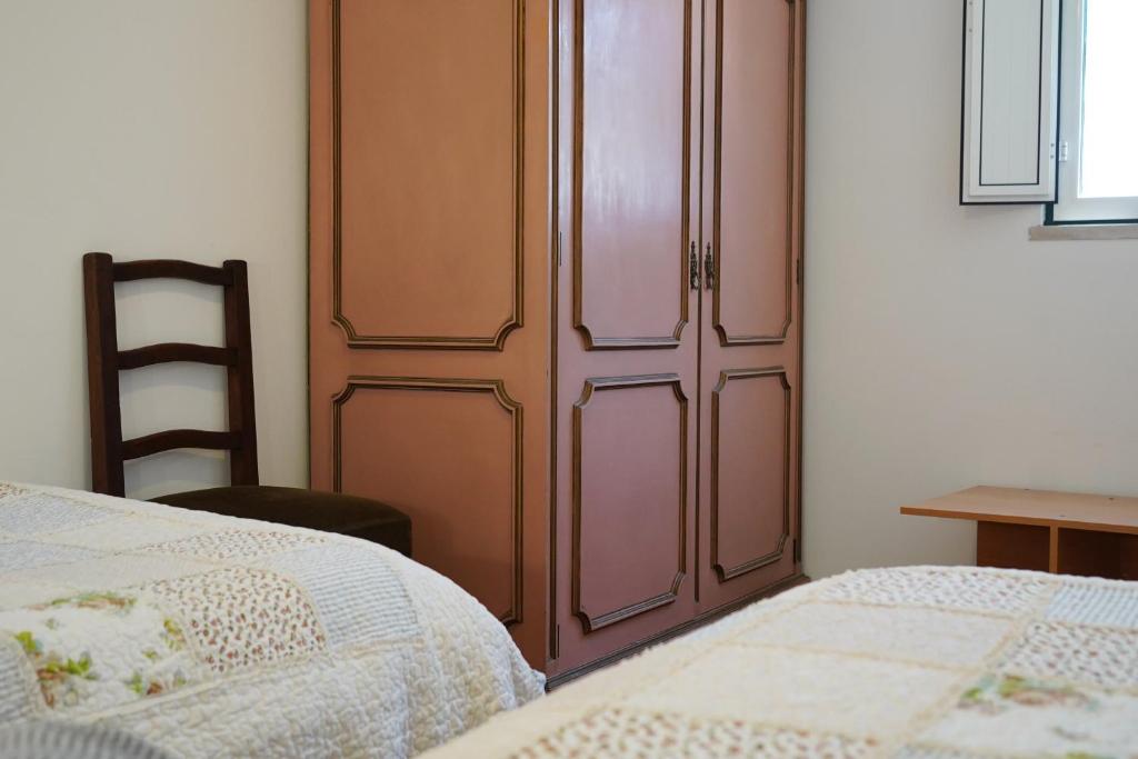 מיטה או מיטות בחדר ב-Casinha Robusto