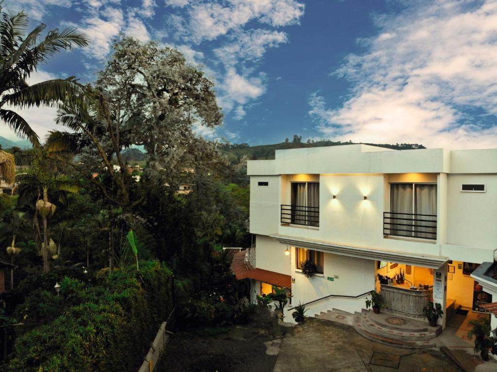 an image of a building with trees in the background at Hotel Campestre Villa Mary in Santa Rosa de Cabal