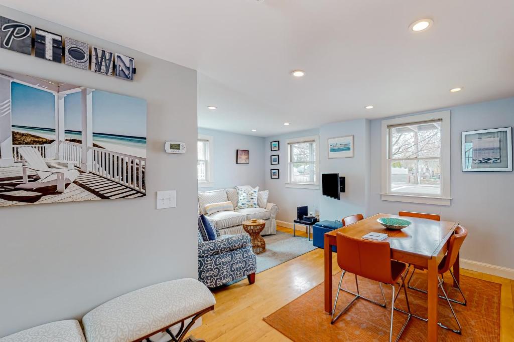 a living room with a table and a couch at The Bradford Bistro in Provincetown