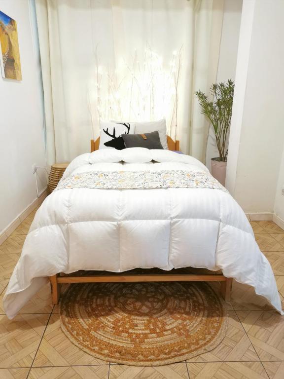 Postel nebo postele na pokoji v ubytování Cusco Kintu House