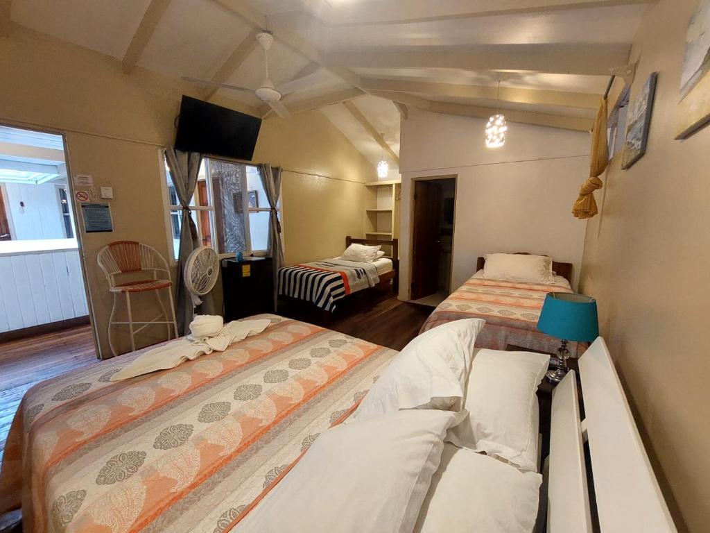 Postel nebo postele na pokoji v ubytování Hotel M&M Beach House