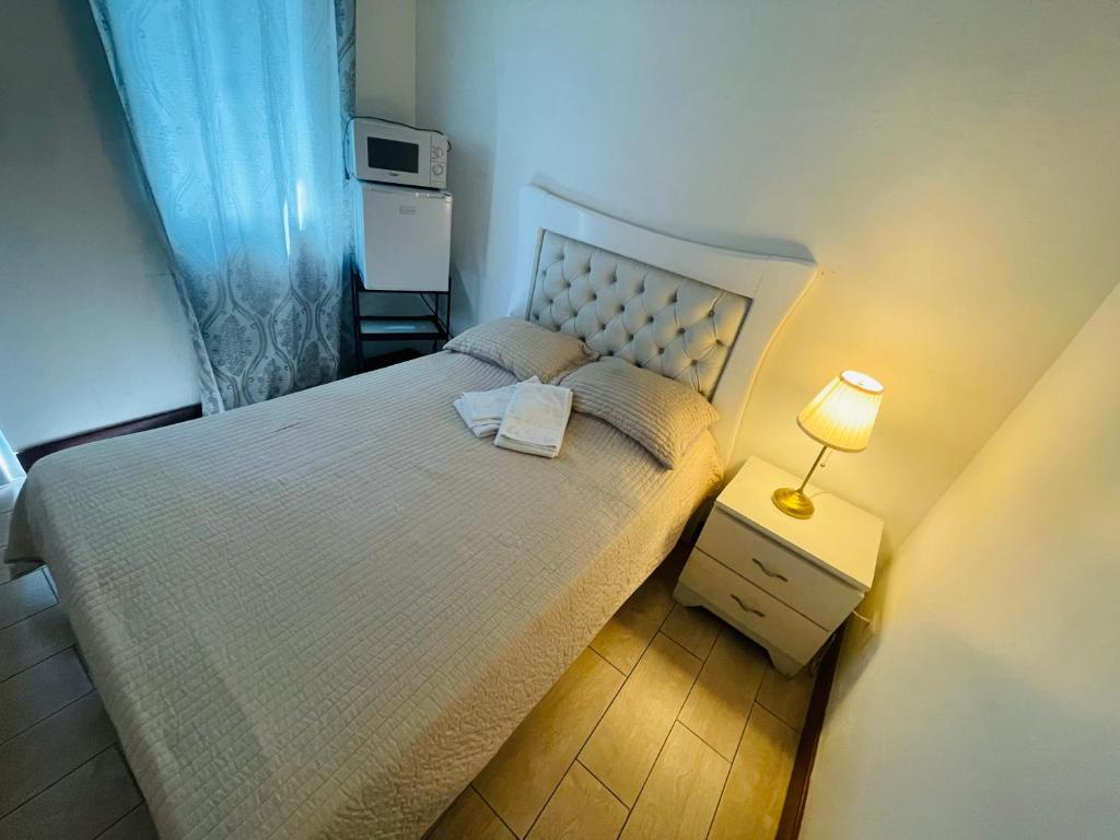 Postel nebo postele na pokoji v ubytování Tavalero Rooms