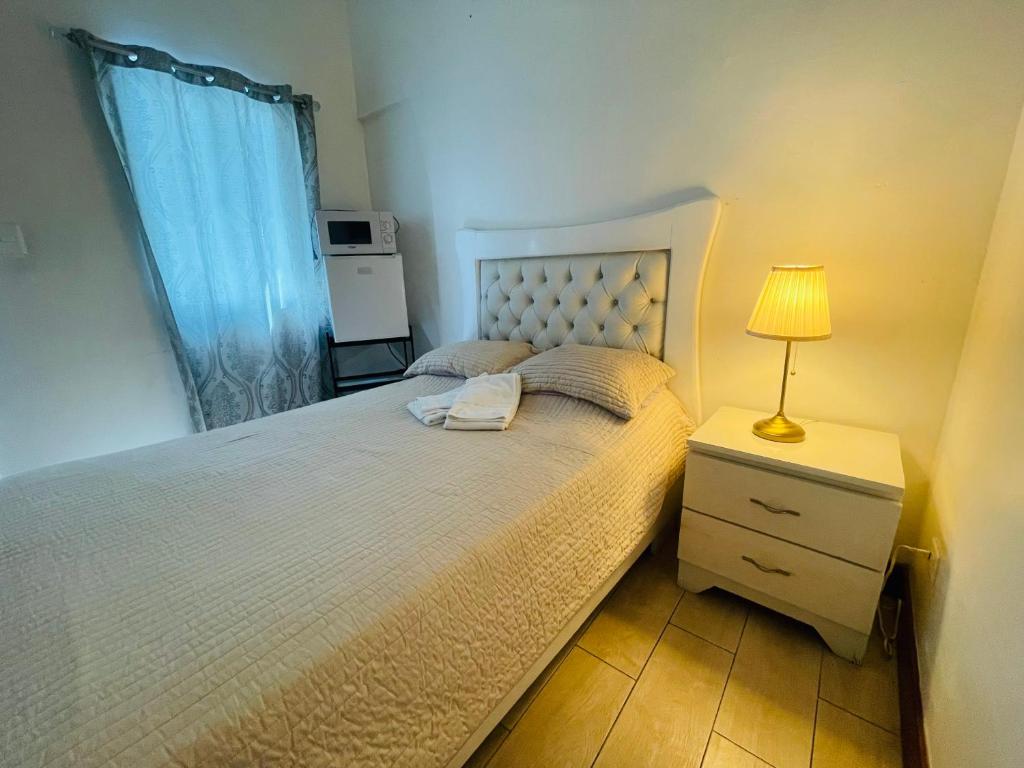 Postel nebo postele na pokoji v ubytování Tavalero Rooms