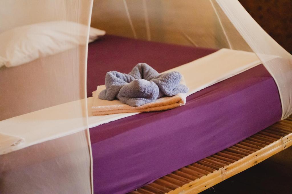 Postel nebo postele na pokoji v ubytování Amami Beach Resort
