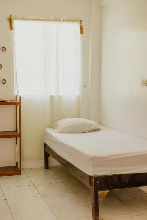 Postel nebo postele na pokoji v ubytování Puerto Galera Hostel