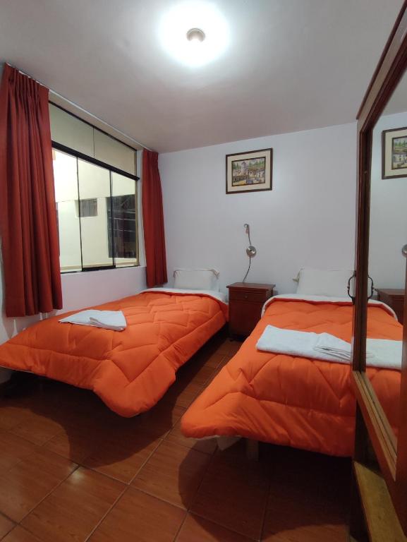 Postel nebo postele na pokoji v ubytování Sunrise Guest House
