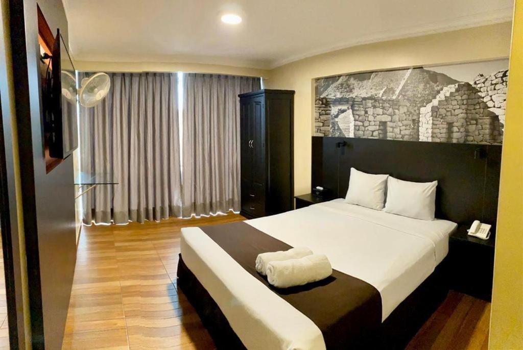 Postel nebo postele na pokoji v ubytování Hotel María Luisa