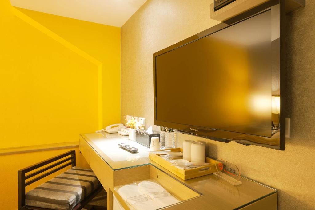 TV a/nebo společenská místnost v ubytování 銀座飯店Ginza Hotel