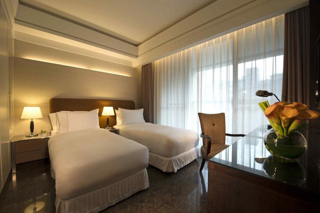 Postel nebo postele na pokoji v ubytování Leofoo Residences