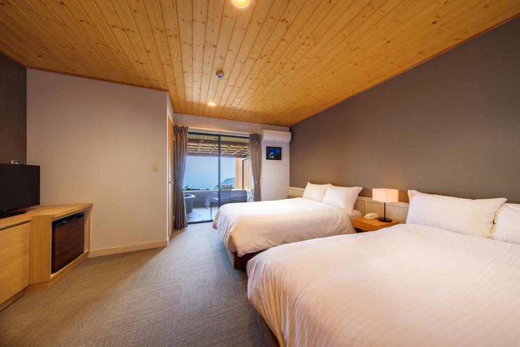 Postel nebo postele na pokoji v ubytování Nishiizu Glamping Tenkuuterrace