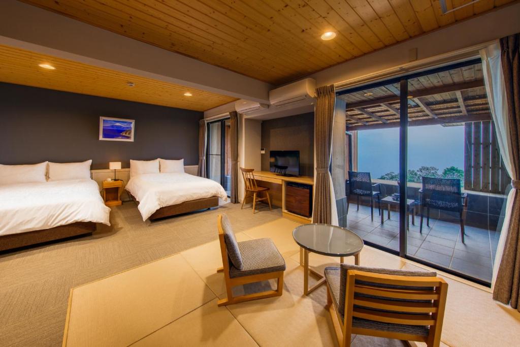 Postel nebo postele na pokoji v ubytování Nishiizu Glamping Tenkuuterrace