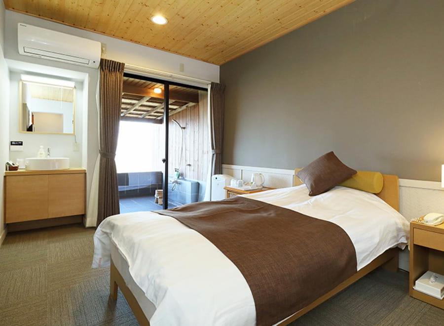 Postel nebo postele na pokoji v ubytování Nishiizu Glamping Tenkuuterrace