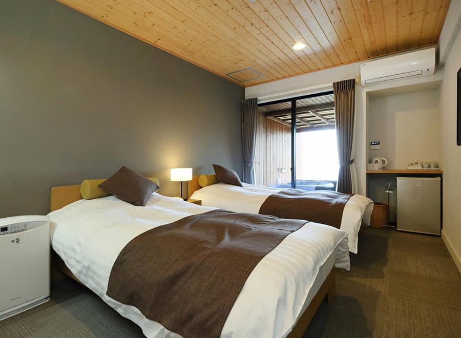 Postel nebo postele na pokoji v ubytování Nishiizu Glamping Tenkuuterrace