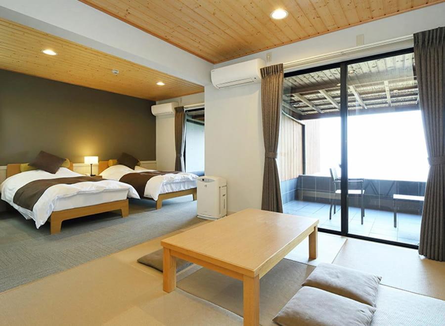 Postel nebo postele na pokoji v ubytování Nishiizu Glamping Tenkuuterrace