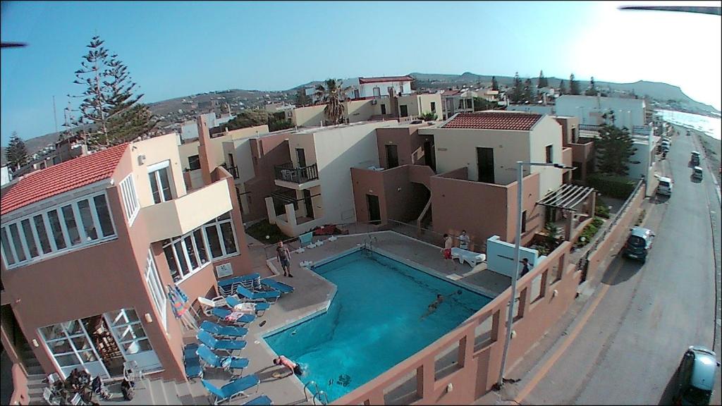 an aerial view of a building with a swimming pool at Pelamare in Kokkini Khanion