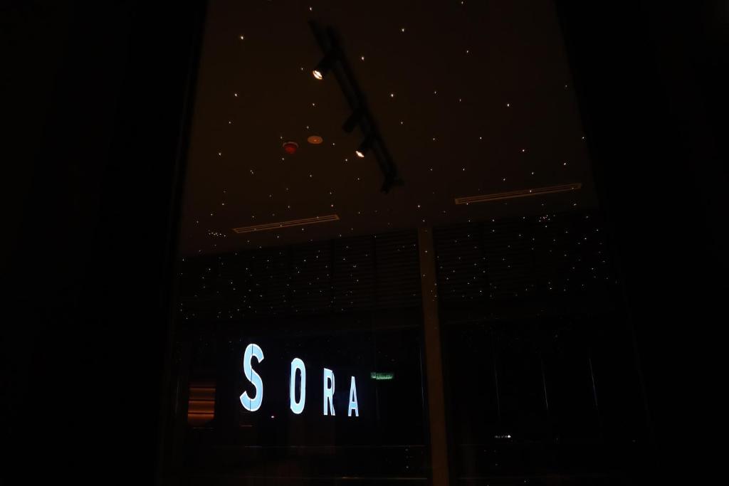 a sign in the window of a store at night at KSL ESPLANADE HOTEL with HOT SPRING in Klang