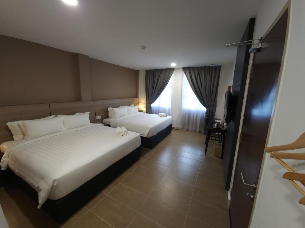 Postel nebo postele na pokoji v ubytování Yu Hotel Chinatown