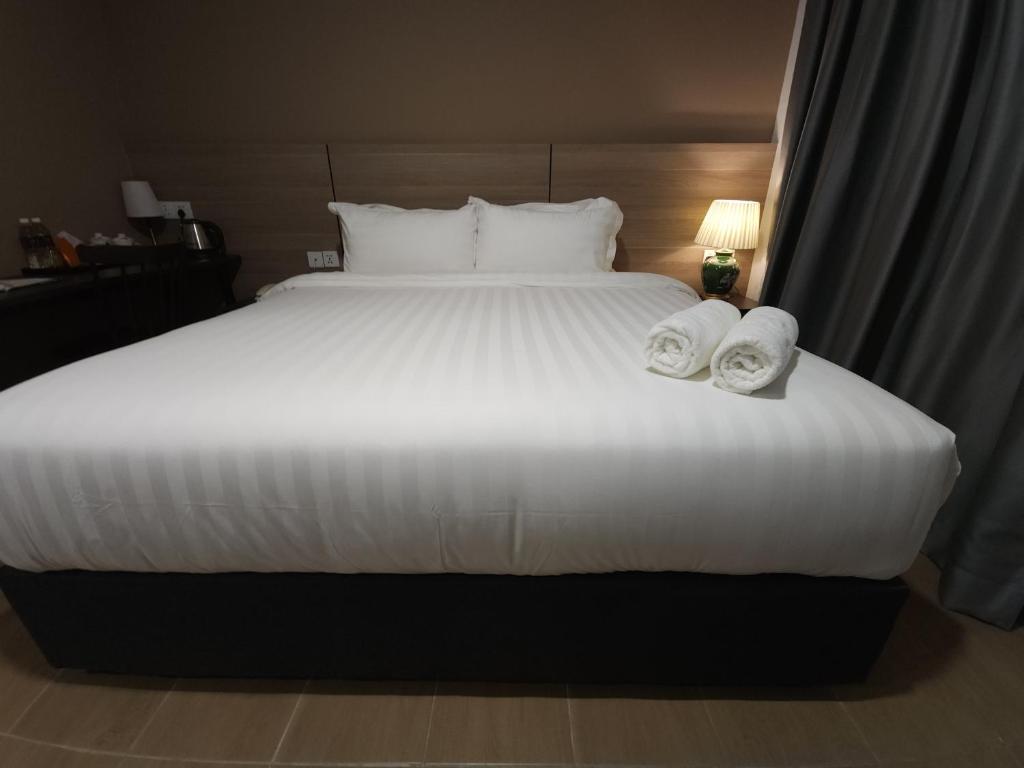 Postel nebo postele na pokoji v ubytování Yu Hotel Chinatown
