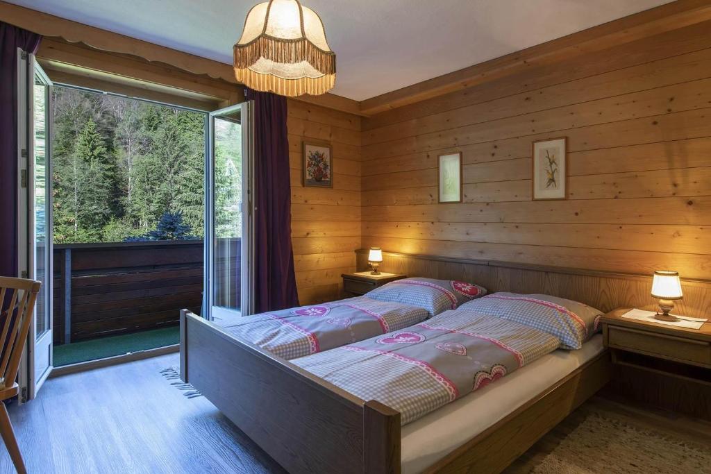 a bedroom with two beds in a room with a window at Ferienwohnung Michael Novablick in Gaschurn