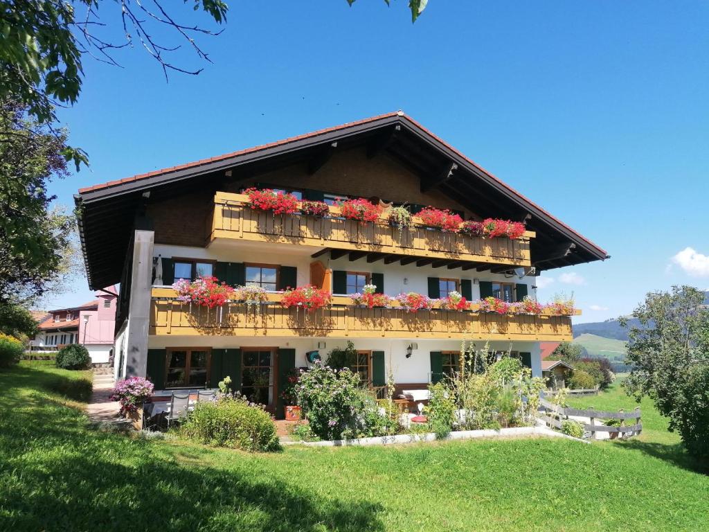 a building with flower boxes on the balconies at Gästehaus Finkel in Maderhalm