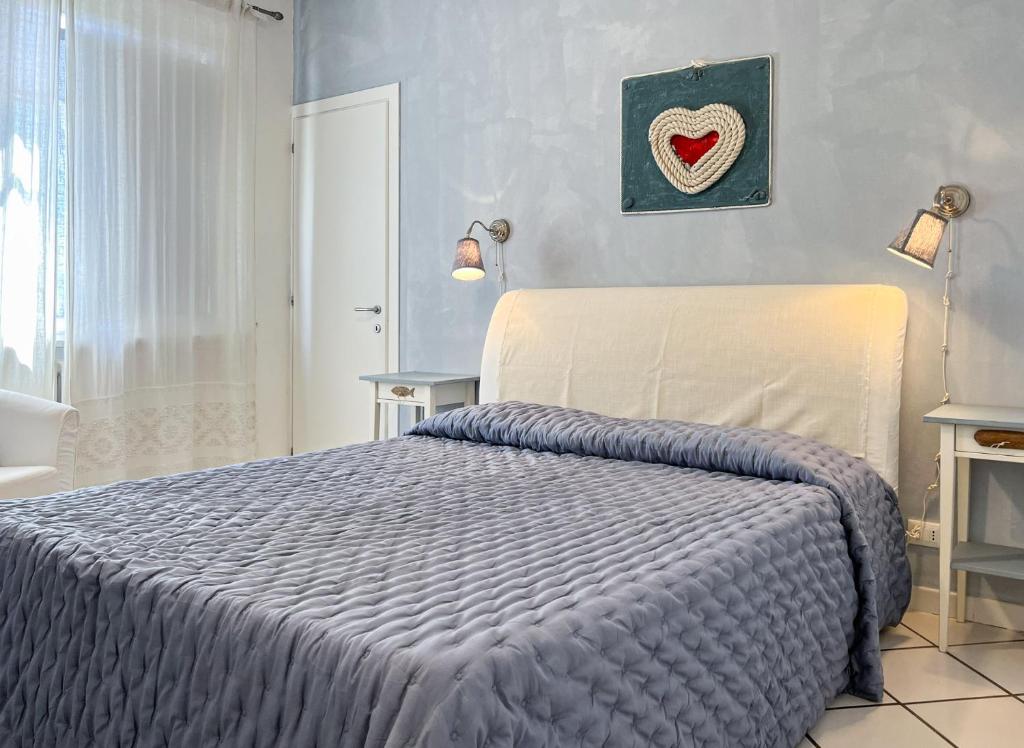Postel nebo postele na pokoji v ubytování A casa di Enrico B&B