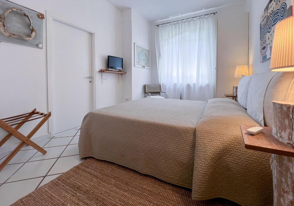 Postel nebo postele na pokoji v ubytování A casa di Enrico B&B