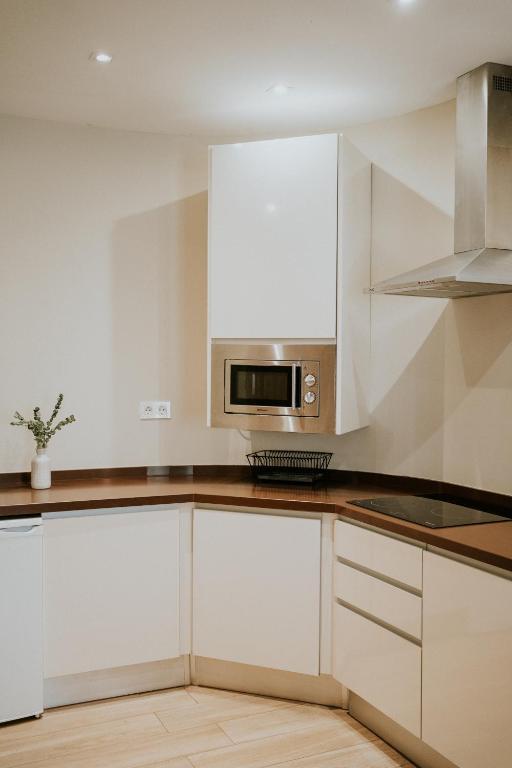Kuchyňa alebo kuchynka v ubytovaní Apartamentos Levante - Mares
