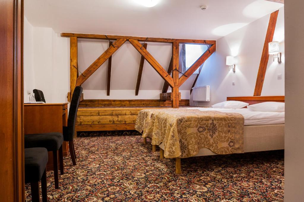 Кровать или кровати в номере Three Crowns Residents