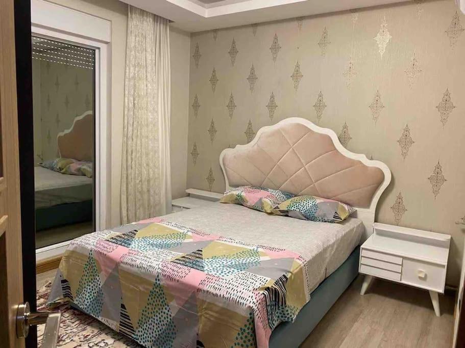 En eller flere senge i et værelse på Antalya liman Apartment 1+1